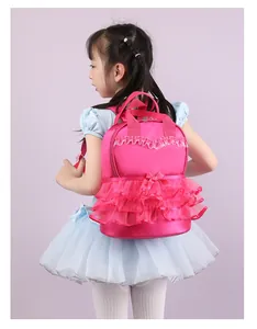 Little girl wearing a bright pink nylon backpack with lace ruffles and bow detail