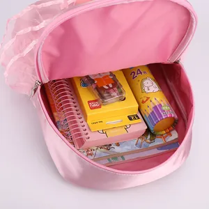 Pink girl's dance backpack with lace trim showing large interior capacity for kids