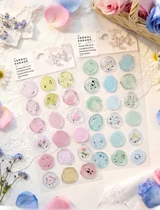 Detailed view of translucent faux wax seal stickers with delicate floral patterns