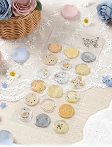Detail view of translucent faux wax seal stickers with floral and insect patterns