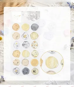Detail view of semi-transparent wax seal stickers with floral and botanical patterns