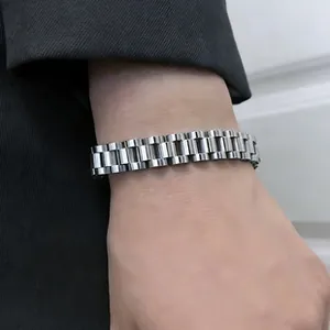 Close-up view of a premium silver stainless steel watch-band style bracelet on a wrist