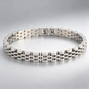 High-quality macro detail of a polished silver-tone stainless steel watch-band link bracelet.
