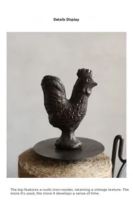 Detailed macro view of a vintage cast iron rooster ornament on a jute twine spool