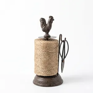 Vintage cast iron rooster twine holder with spool of jute string and scissors for decor