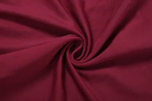 Vue macro de la texture du tissu côtelé bordeaux de qualité pour ensemble jupe