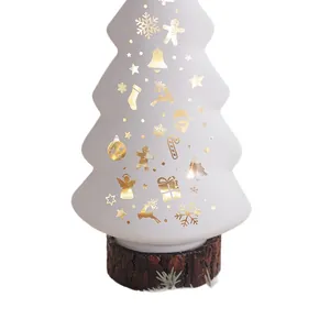 Glowing Christmas tree table decoration with elegant gold holiday icons