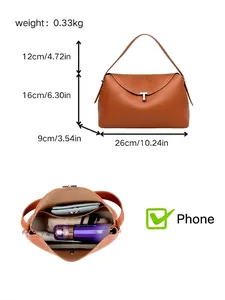 Vintage minimalist brown leather pillow handbag with dimensions and internal capacity view