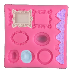 Pink silicone fondant mold featuring vintage frames, gems, and lace cake decorations.