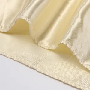 Champagne silk satin square scarf featuring smooth texture and fine edge stitching