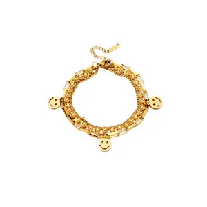 Gold multi-layer chain bracelet with smiley pendants and beads in polished stainless steel