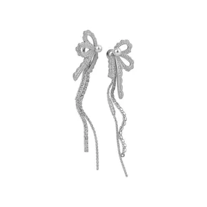 Elegant lace bow tassel earrings with white pearls and sparkling cubic zirconia stones