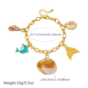 Gold-plated ocean charm bracelet with dolphin and shell pendants and size measurements