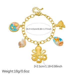 Detailed view of gold plated ocean charm bracelet featuring octopus and shell pendants