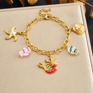 Gold plated stainless steel ocean theme charm bracelet with lobster and starfish charms