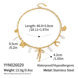 Detail view of gold stainless steel necklace with butterfly and pearl charms