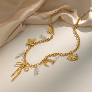 Detailed view of luxury 18K gold plated stainless steel necklace with pearl and butterfly charms