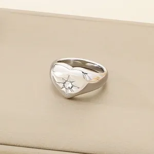 Minimalist heart-shaped silver titanium steel ring with sparkling eight-pointed star