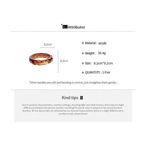 Brown acrylic blooming pattern bangle detail with material and size specifications