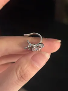 Detailed view of a sparkling silver heart-shaped ear cuff with inlaid zirconia