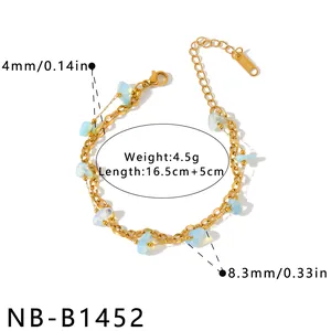 Detail view of 18K gold plated stainless steel bracelet with acrylic stones and specs