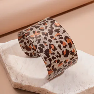 Retro leopard print acrylic wide cuff bracelet with glitter finish