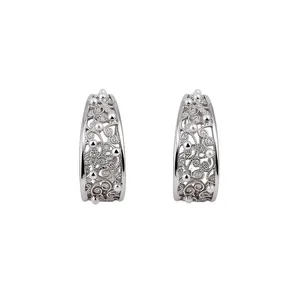 Vintage silver C-shaped hoop earrings with intricate filigree patterns and zircons