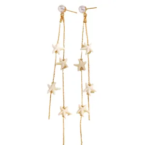 Elegant long tassel earrings featuring white faux pearls and multiple starfish charms