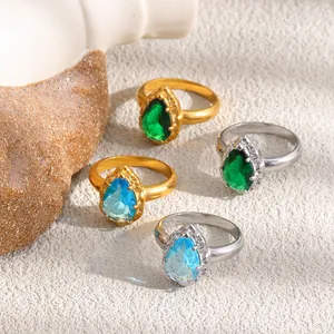 Elegantes anillos de circonita en forma de lágrima en oro y plata con gemas azules