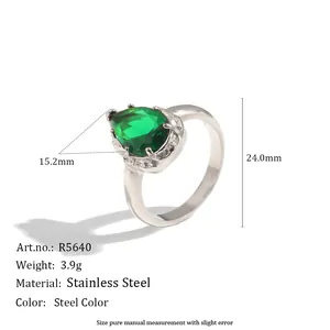 Anillo de acero inoxidable con circón de gota verde y detalles de dimensiones.