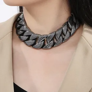 Close-up of vintage patterned stainless steel chunky curb chain choker necklace style