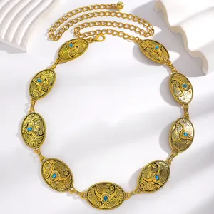 Ceinture chaîne dorée vintage avec pendentifs tête de taureau et pierres bleues