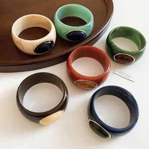 Elegant set of colorful acrylic marbled bangles with stylish oval gemstone-like accents