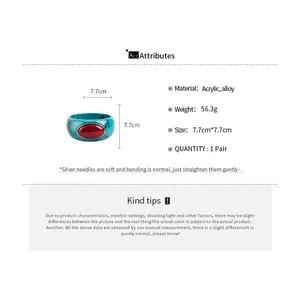 Detailed specs of a bohemian acrylic bangle with red resin inlay and dimensions.