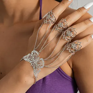 Elegant silver hollow butterfly hand chain with four rings for a unique bohemian look.