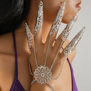 Detailed view of silver gothic finger armor bracelet with hollow out lace patterns
