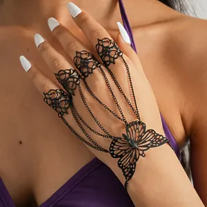 Gothic black butterfly hand chain bracelet with filigree finger rings and chain detail