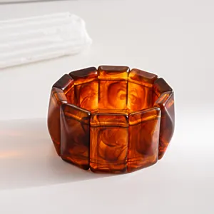 Close-up of vintage amber acrylic link bracelet with tortoiseshell marbled pattern