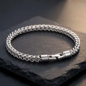 Close-up of 5mm stainless steel wheat chain bracelet with rotating clasp on stone