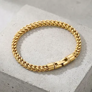 Close-up detail of a 5mm gold stainless steel dragon bone chain with rotatable buckle.