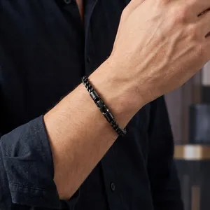 Close-up of a 5mm black stainless steel wheat chain bracelet with rotatable clasp