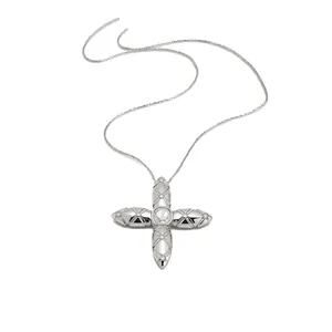 Elegant silver cross pendant necklace featuring quilted pattern and clear crystals