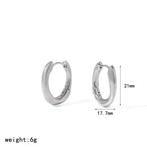 Detailed view of silver crumpled hoop earrings with 21mm height and 17.7mm width