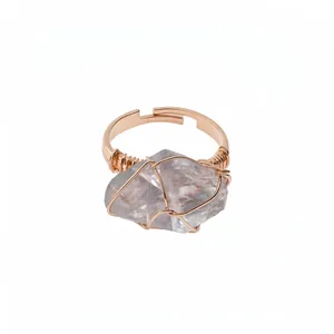 Exquisite wire-wrapped natural crystal raw stone ring featuring a rose gold adjustable band