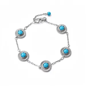 Pulsera plateada retro con piedras de resina turquesa y diseños circulares elegantes