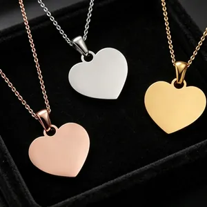 Detail shot of polished stainless steel heart pendant necklaces in three metallic tones