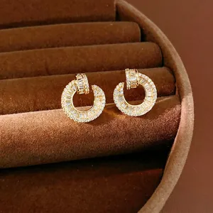 Elegant 18k gold plated round stud earrings with sparkling cubic zirconia stones.