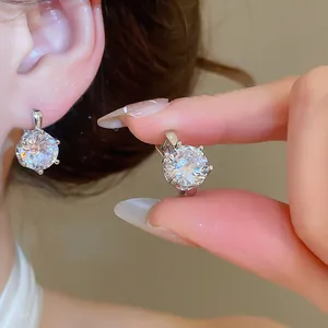 Macro detail of brilliant-cut cubic zirconia earrings in a elegant six-prong setting