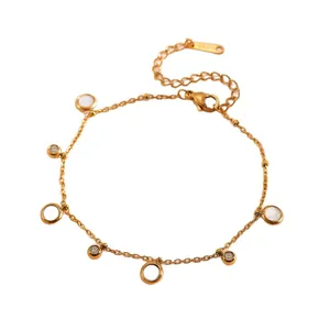 Minimalist gold stainless steel bracelet with dainty circular charms and crystal inlay