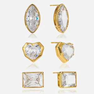 Detailed view of three shapes of sparkling zircon stud earrings in gold plated steel.